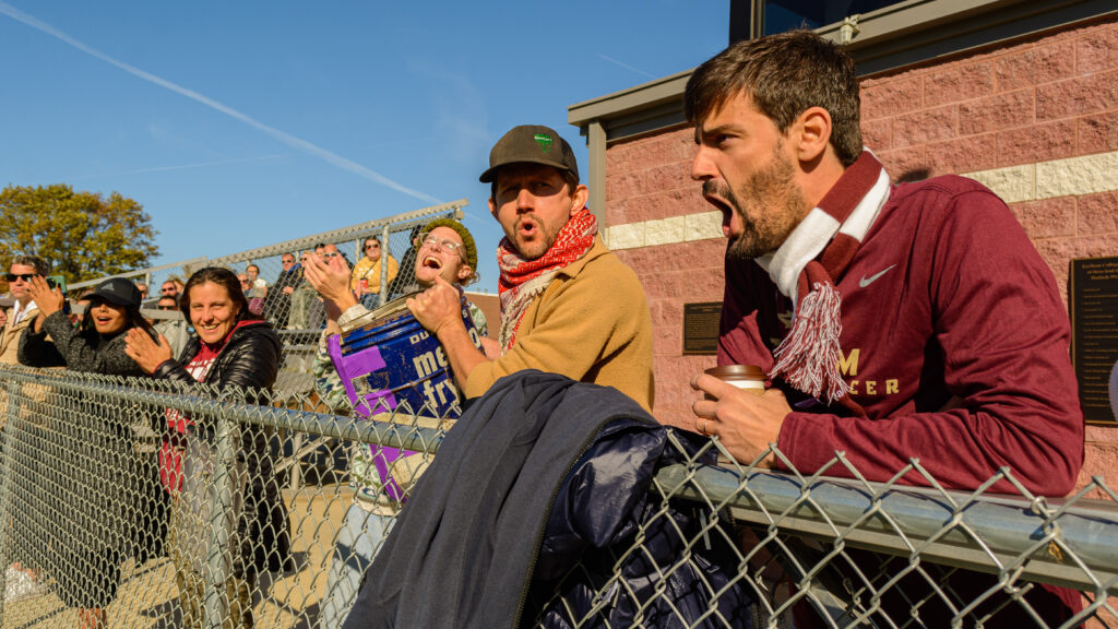 Earlham fans cheer for the Quakers in a game. 